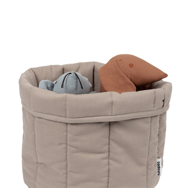 timeless storage basket with toys in it