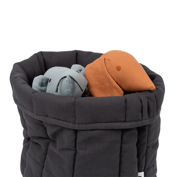 classic storage basket with dog toys in it